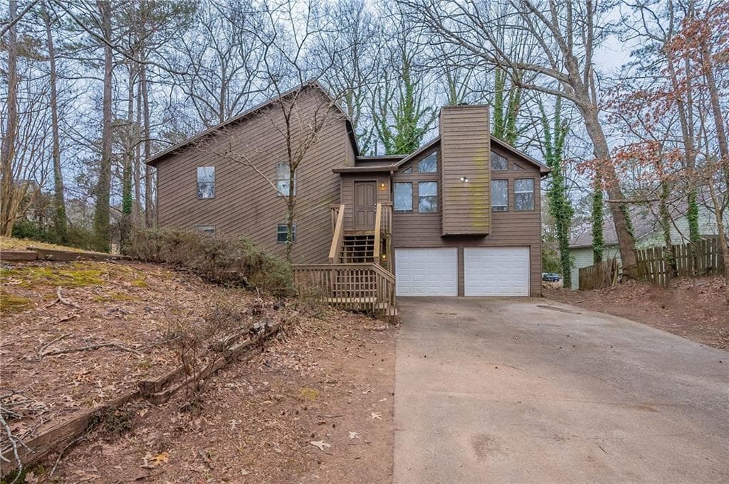 5 bedroom, 3 bathroom single family residence sold at 123 Williamsburg Lane, Woodstock, GA 30189