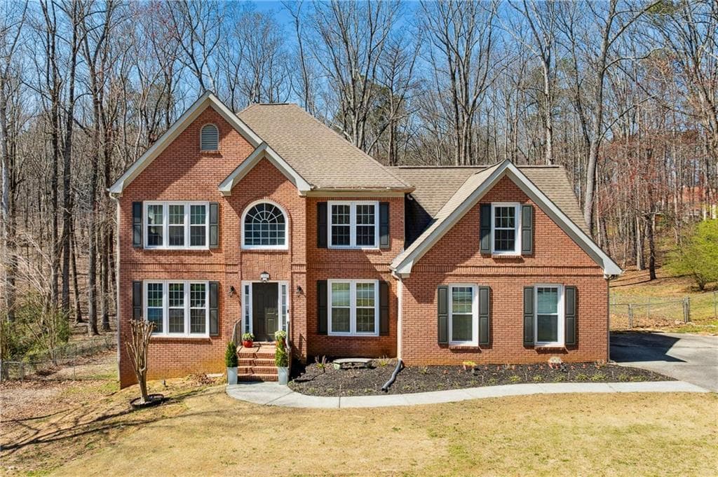 4 bedroom, 3 bathroom single family residence sold at 1880 Oak Wind Lane, Buford, GA 30519