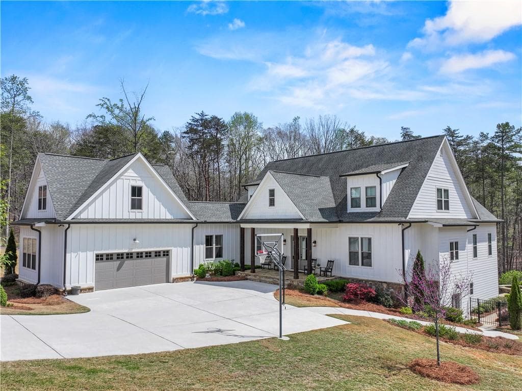 4 bedroom, 5 bathroom, 7,700 sq ft single family residence sold at 6061 Bluewater Boulevard, Gainesville, GA 30506