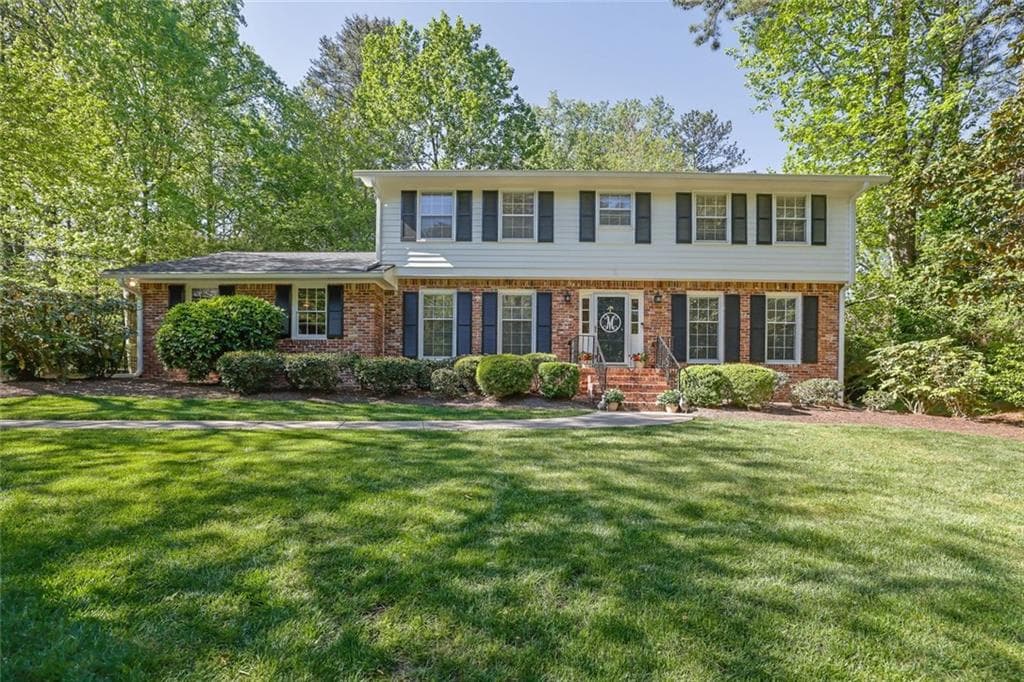 4 bedroom, 3 bathroom single family residence sold at 1569 Chateau Drive, Dunwoody, GA 30338