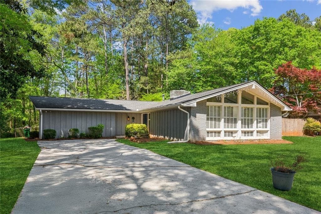 4 bedroom, 2 bathroom single family residence sold at 553 Candlewood Drive, Stone Mountain, GA 30088