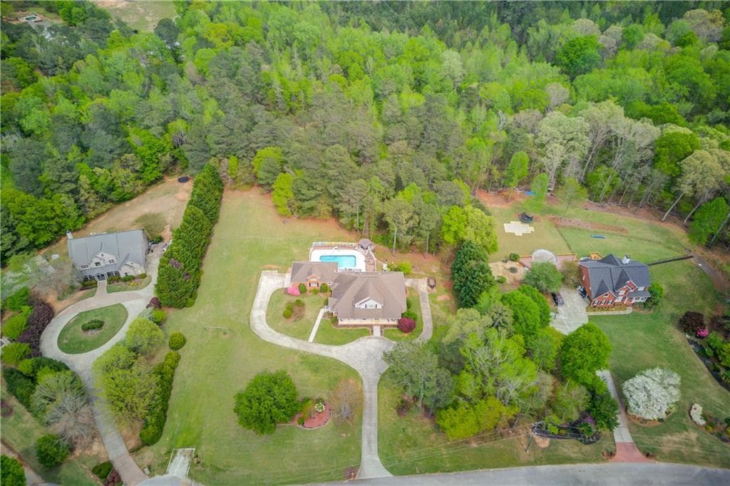 6 bedroom, 6 bathroom, 6,934 sq ft single family residence sold at 5040 Fawn Valley Drive, Loganville, GA 30052