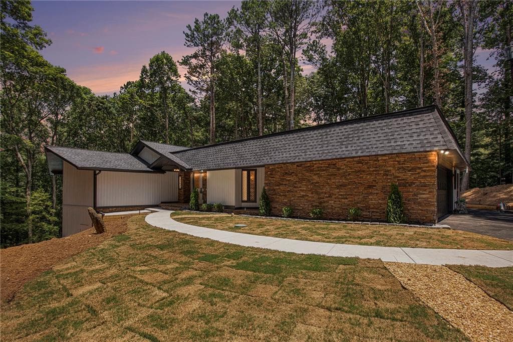 6 bedroom, 5 bathroom, 5,318 sq ft single family residence sold at 9025 Huntcliff Trace, Atlanta, GA 30350