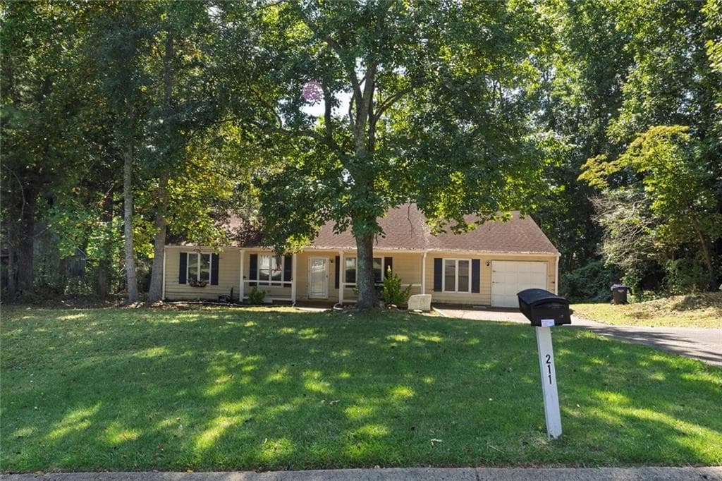 4 bedroom, 2 bathroom, 1,600 sq ft single family residence sold at 211 Windcrest Court, Woodstock, GA 30188