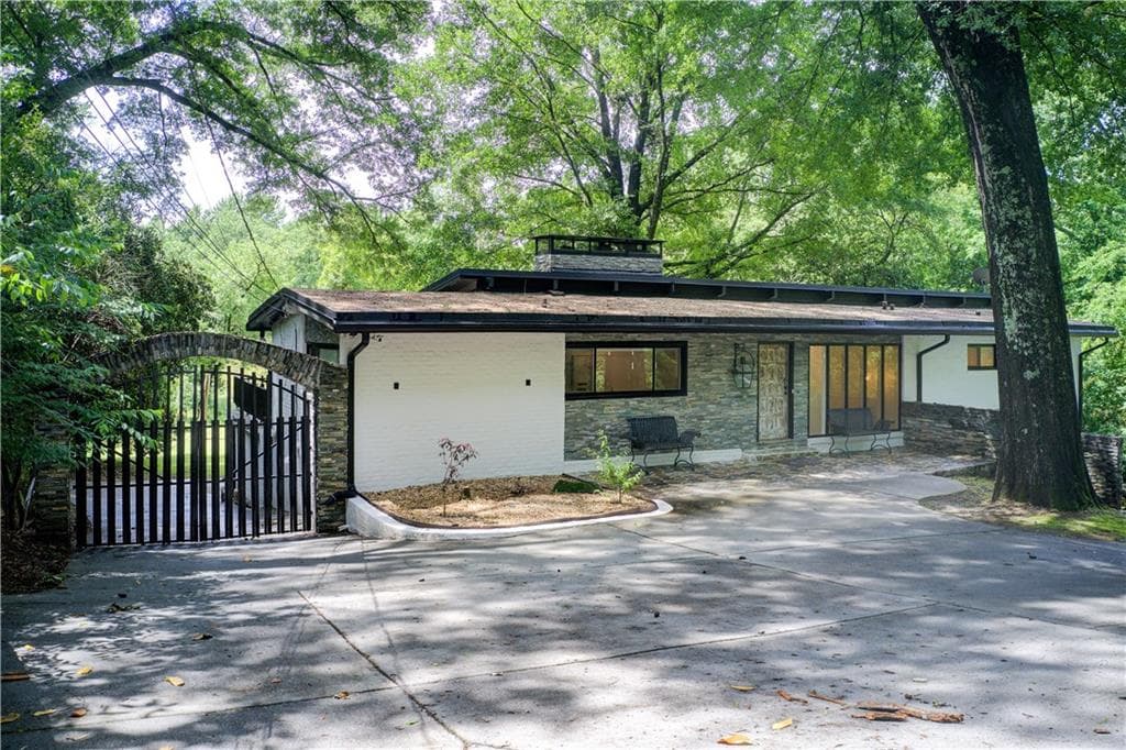 4 bedroom, 4 bathroom, 3,100 sq ft single family residence sold at 1676 Moores Mill Road, Atlanta, GA 30327