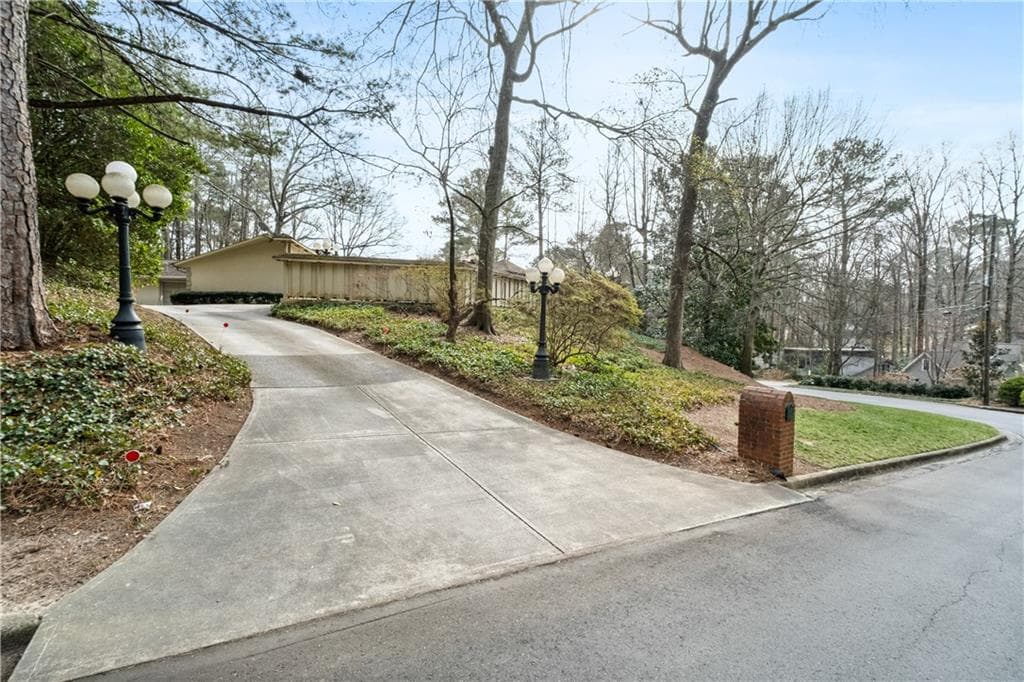 4 bedroom, 3 bathroom, 4,278 sq ft single family residence sold at 6095 Weatherly Drive, Atlanta, GA 30328