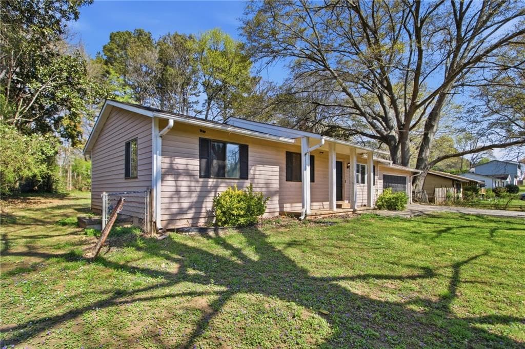 3 bedroom, 2 bathroom, 1,424 sq ft single family residence for sale at 4289 Rex Road, Rex, GA 30273