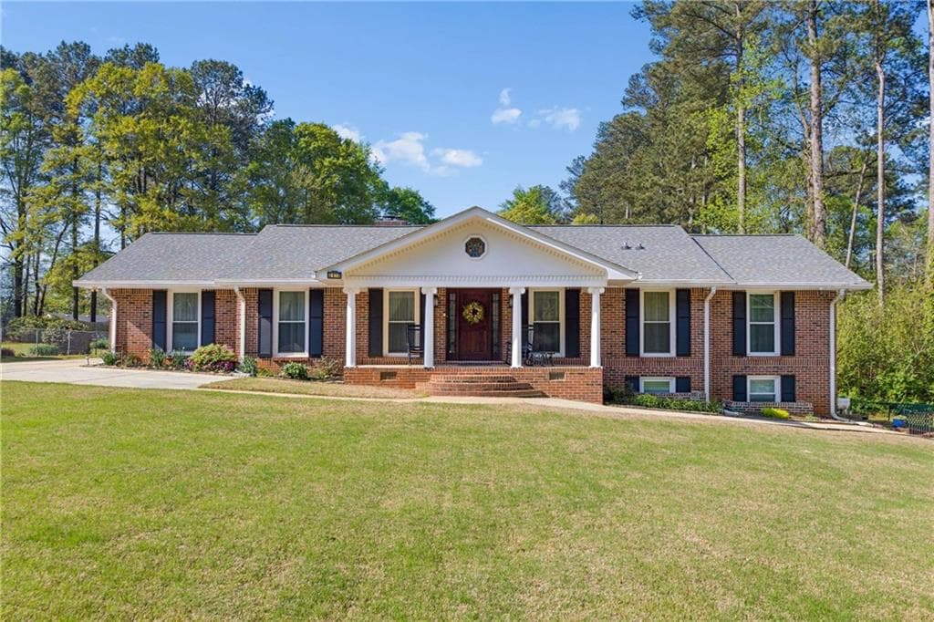 6 bedroom, 4 bathroom, 3,890 sq ft single family residence sold at 2410 Henderson Road, Tucker, GA 30084