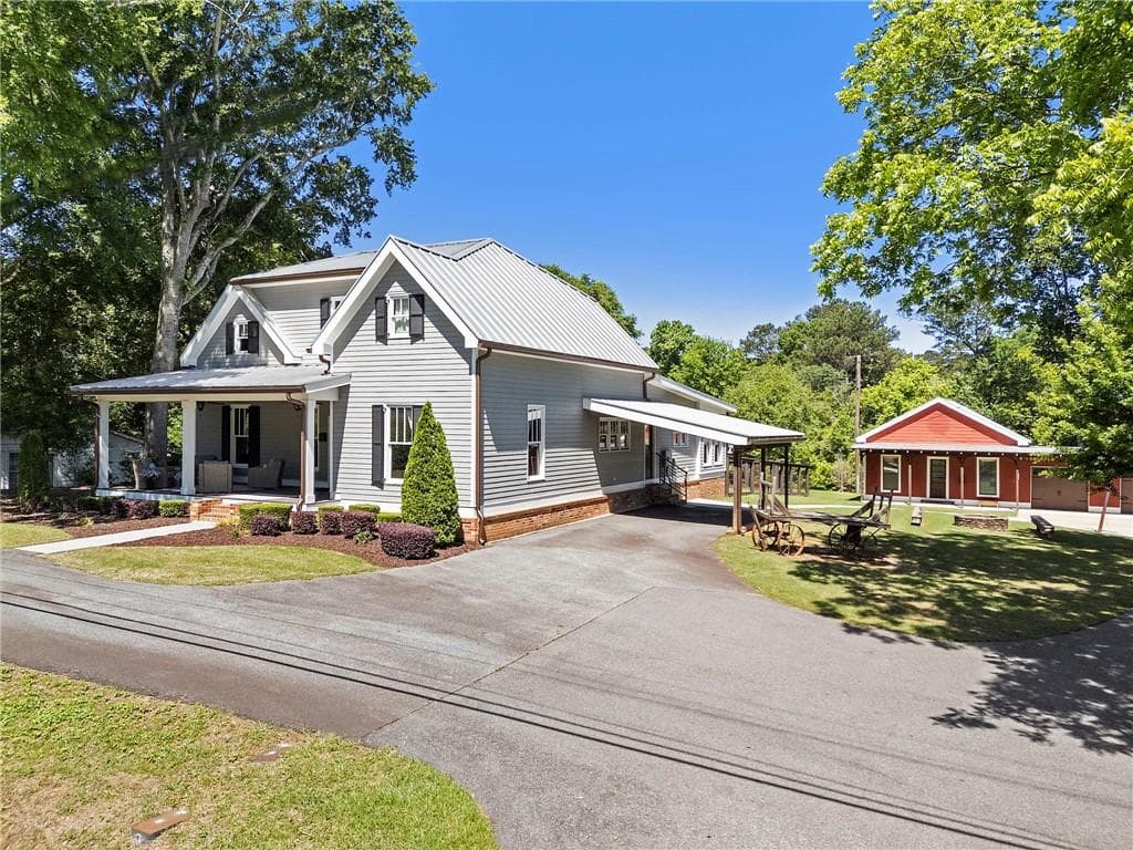 7 bedroom, 8 bathroom, 6,388 sq ft single family residence sold at 527 Main Street, Suwanee, GA 30024