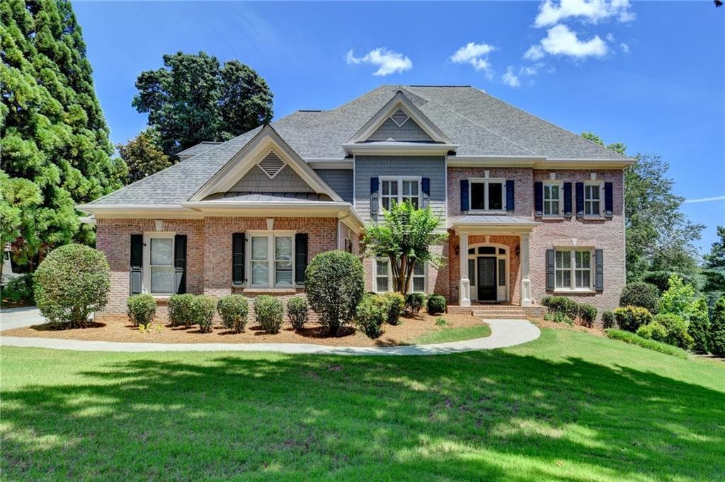 5 bedroom, 6 bathroom, 5,185 sq ft single family residence sold at 6940 Laurel Oak Drive, Suwanee, GA 30024