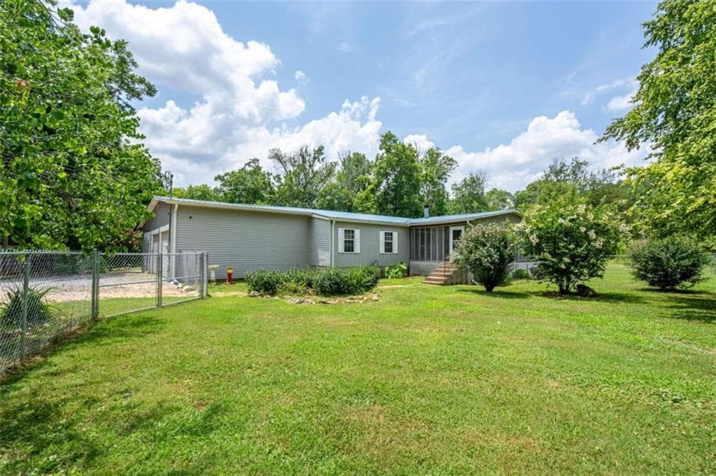 4 bedroom, 2 bathroom, 3,344 sq ft single family residence sold at 1054 Booze Mountain Road, Lindale, GA 30147