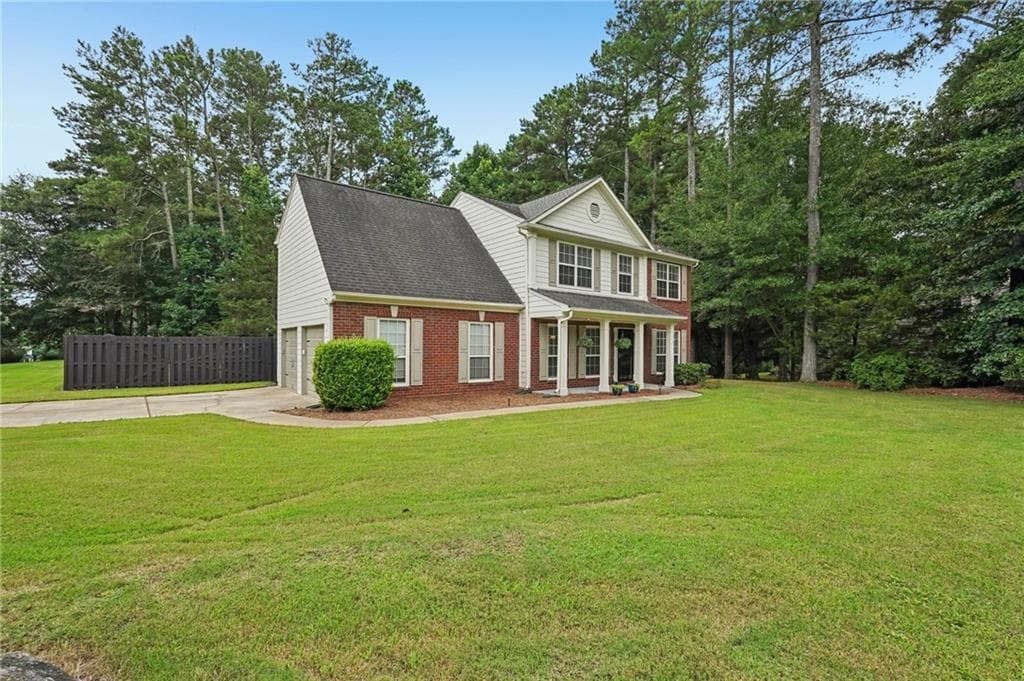 4 bedroom, 3 bathroom, 2,210 sq ft single family residence for sale at 5790 Woodstone Drive, Cumming, GA 30028