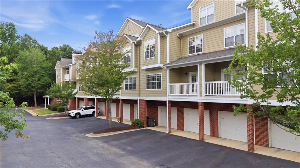 2 bedroom, 3 bathroom, 1,379 sq ft townhouse for sale at 5110 Woodland Lane, Alpharetta, GA 30009