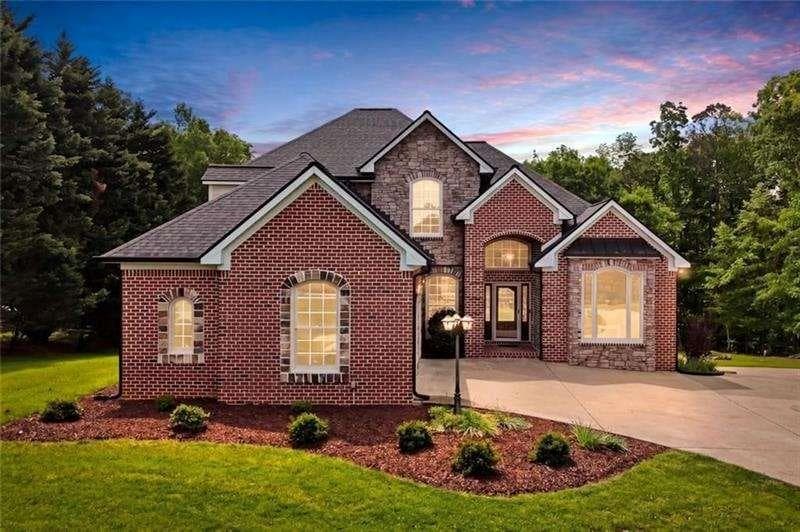5 bedroom, 4 bathroom, 4,988 sq ft single family residence for sale at 2235 Lower Burris Road, Canton, GA 30114