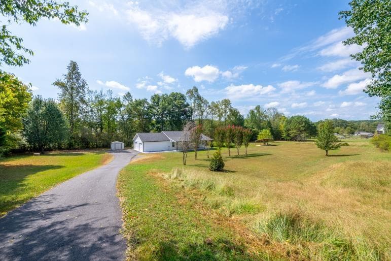4 bedroom, 3 bathroom, 1,680 sq ft single family residence for sale at 2400 Flatbottom Road, Ball Ground, GA 30107
