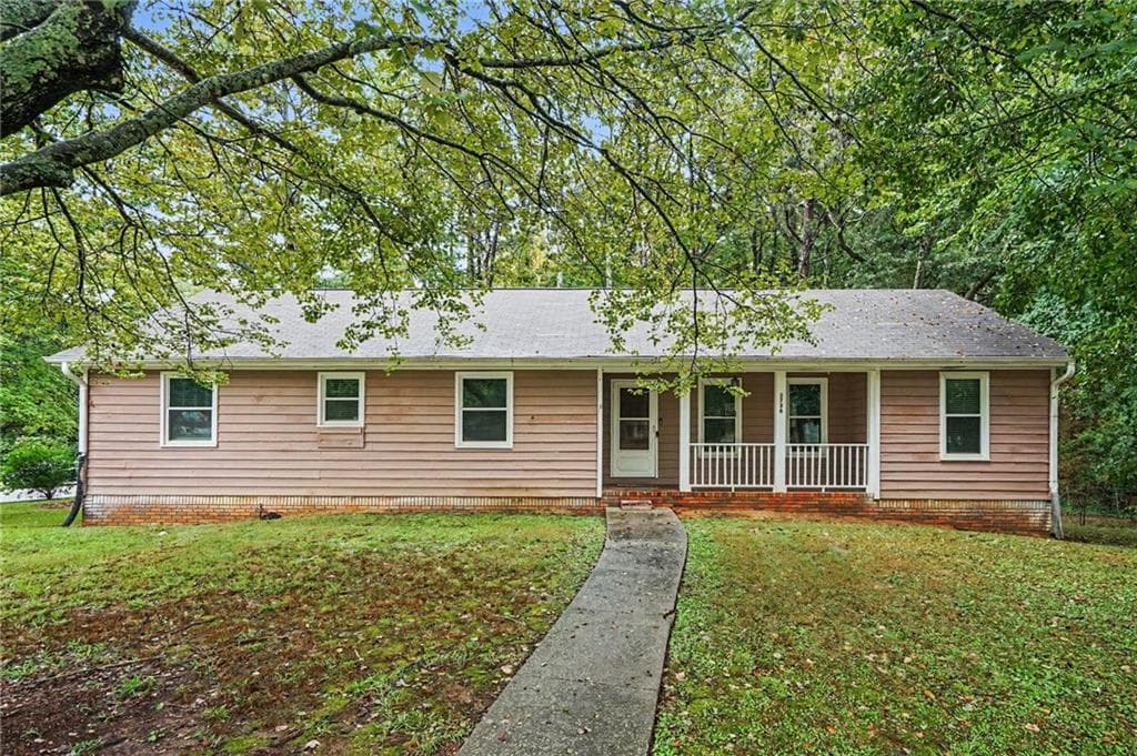 4 bedroom, 3 bathroom, 2,084 sq ft single family residence for sale at 2726 Raven Wood Drive, Snellville, GA 30078