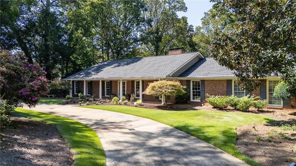 5 bedroom, 4 bathroom, 5,358 sq ft single family residence for sale at 5580 Lake Island Drive, Sandy Springs, GA 30327