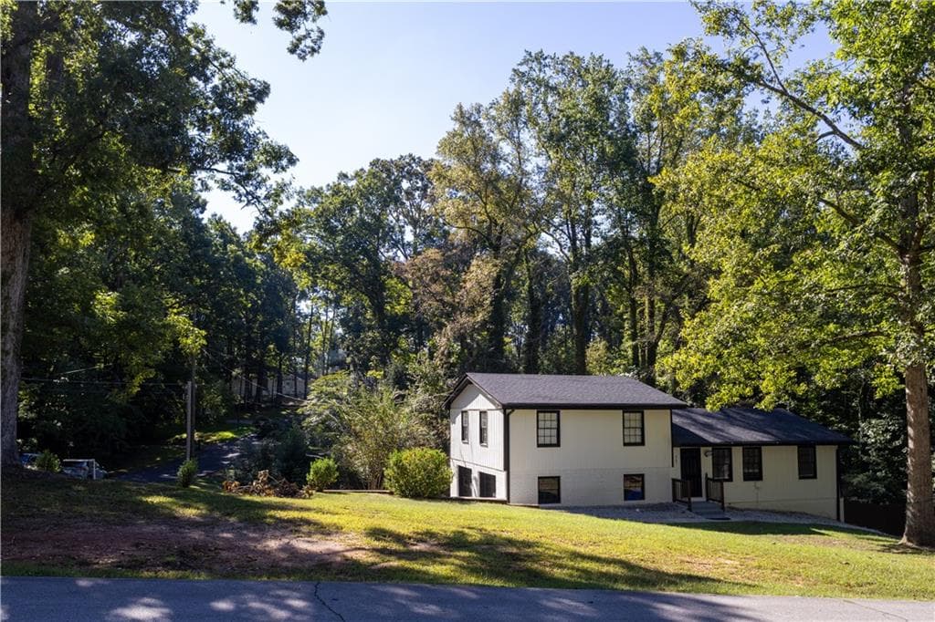 4 bedroom, 3 bathroom, 1,820 sq ft single family residence for sale at 567 Woodland Lane, Lawrenceville, GA 30043