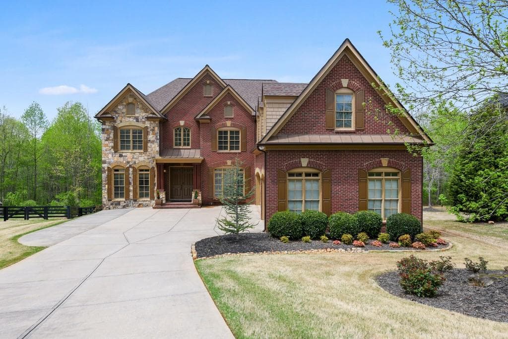 6 bedroom, 5 bathroom, 6,952 sq ft single family residence sold at 6095 Boulder Bluff Drive, Cumming, GA 30040