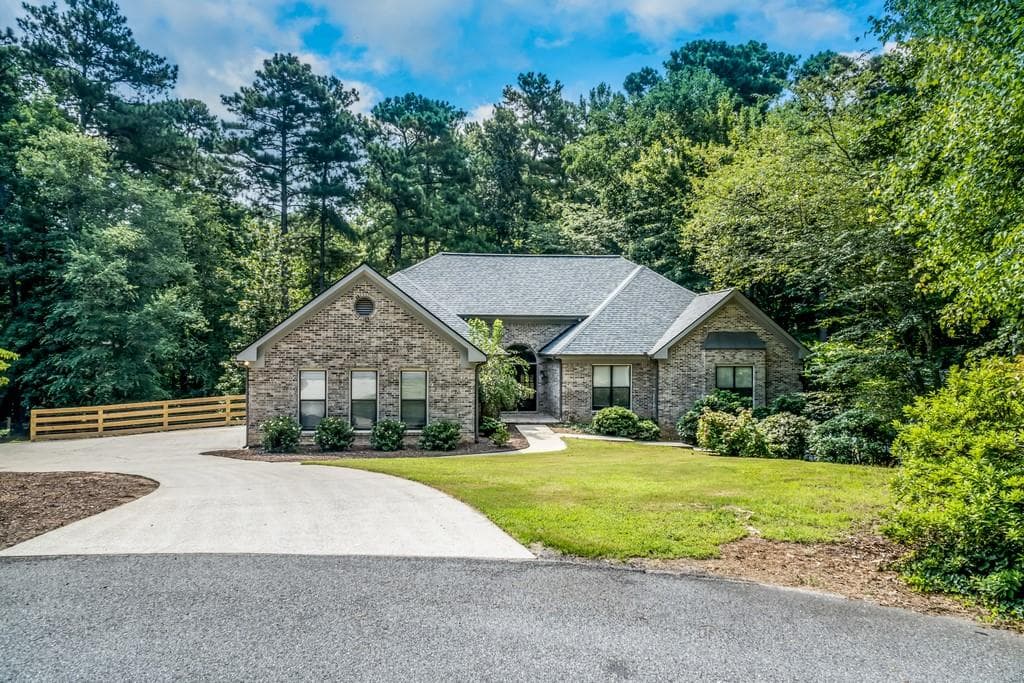5 bedroom, 6 bathroom, 6,112 sq ft single family residence sold at 2590 Fairview Drive, Cumming, GA 30041