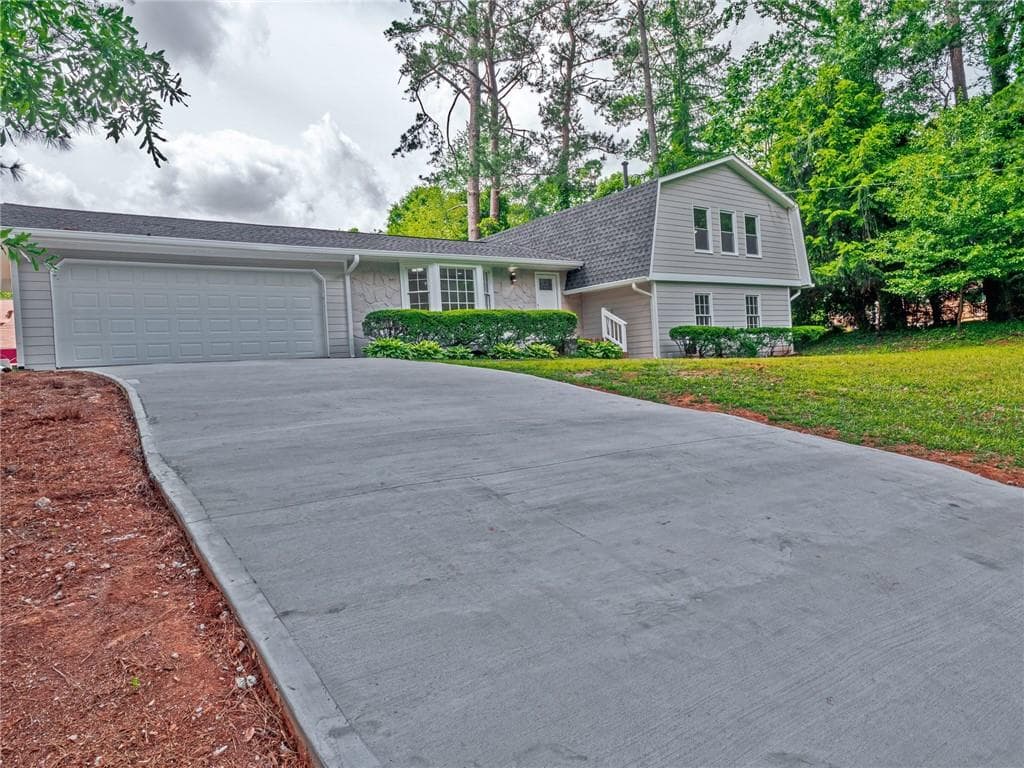 4 bedroom, 3 bathroom single family residence sold at 4032 Stonemont Drive, Lilburn, GA 30047