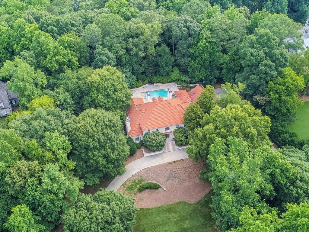 6 bedroom, 9 bathroom, 9,956 sq ft single family residence sold at 1765 Garraux Place, Atlanta, GA 30327