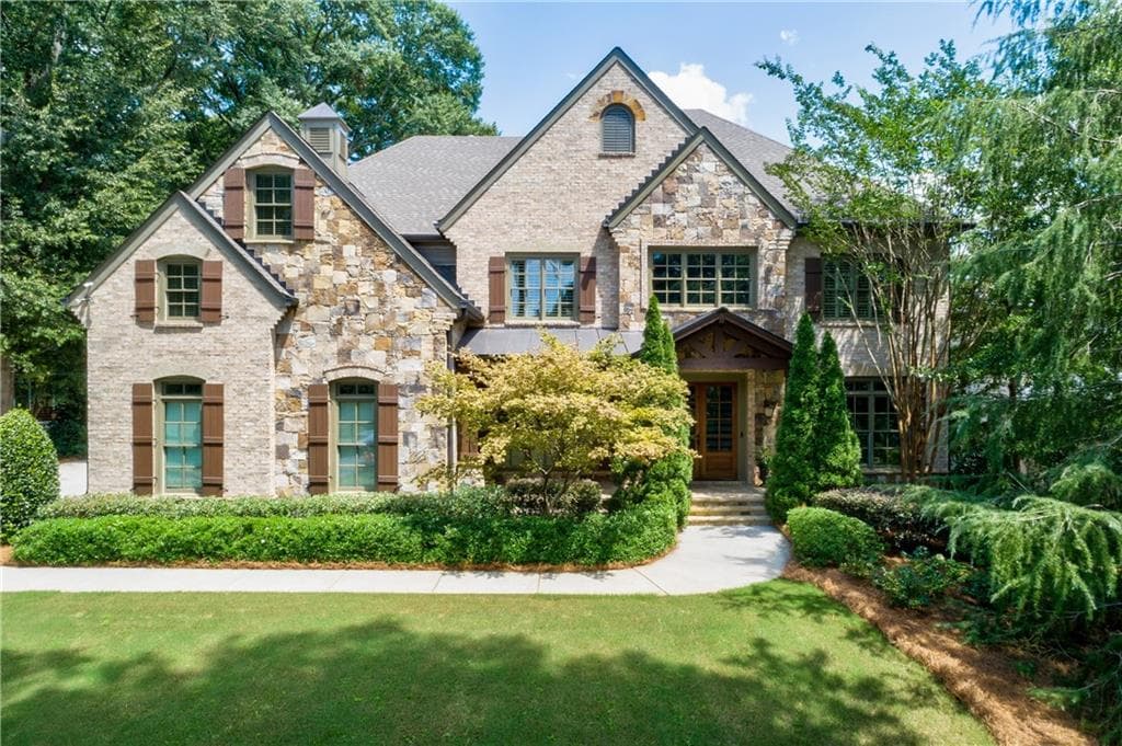 6 bedroom, 7 bathroom, 8,679 sq ft single family residence sold at 5035 Lake Forrest Drive, Sandy Springs, GA 30342