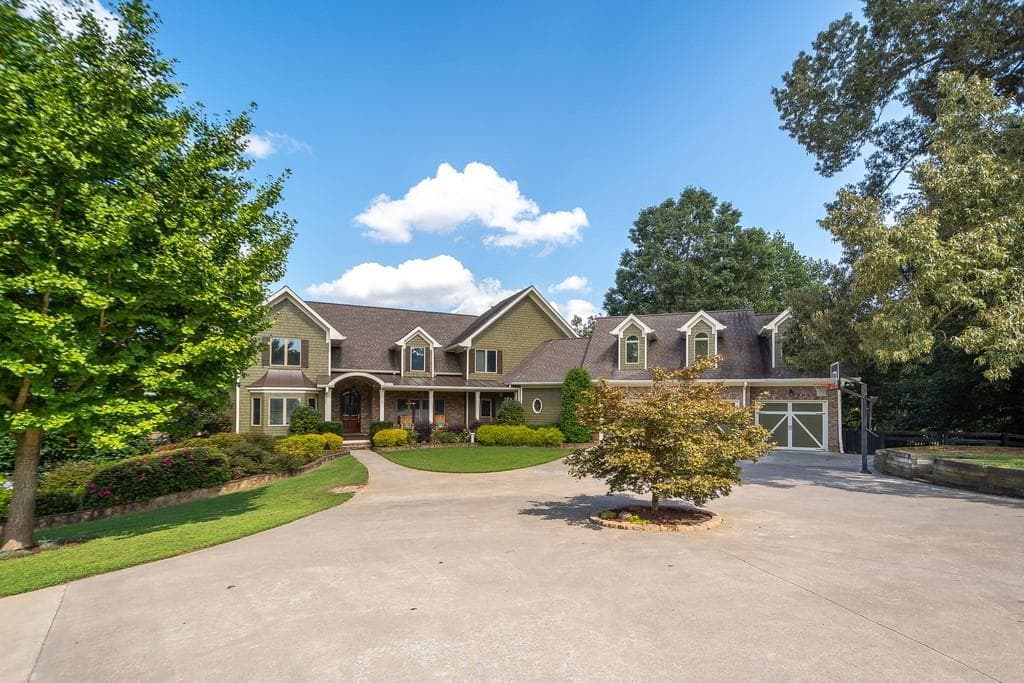 5 bedroom, 6 bathroom, 9,108 sq ft single family residence sold at 335 Lakeside Trail, Canton, GA 30115