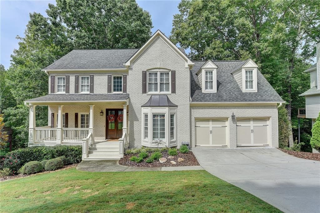5 bedroom, 4 bathroom, 3,811 sq ft single family residence sold at 5585 Ashewoode Downs Drive, Alpharetta, GA 30005