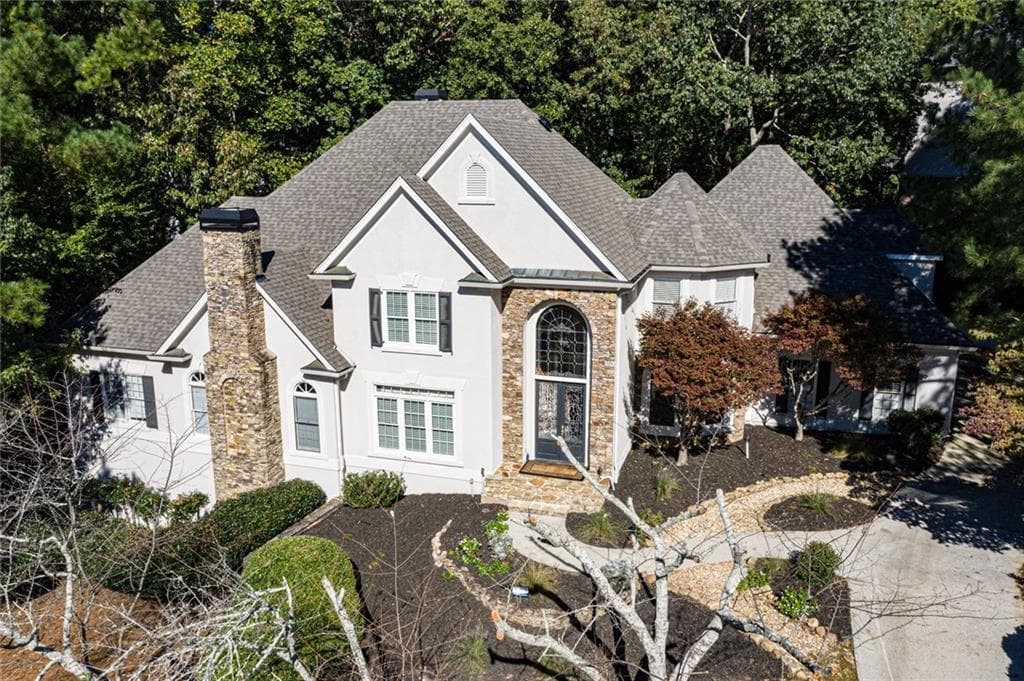 6 bedroom, 7 bathroom, 8,718 sq ft single family residence sold at 8515 Sentinae Chase Drive, Roswell, GA 30076