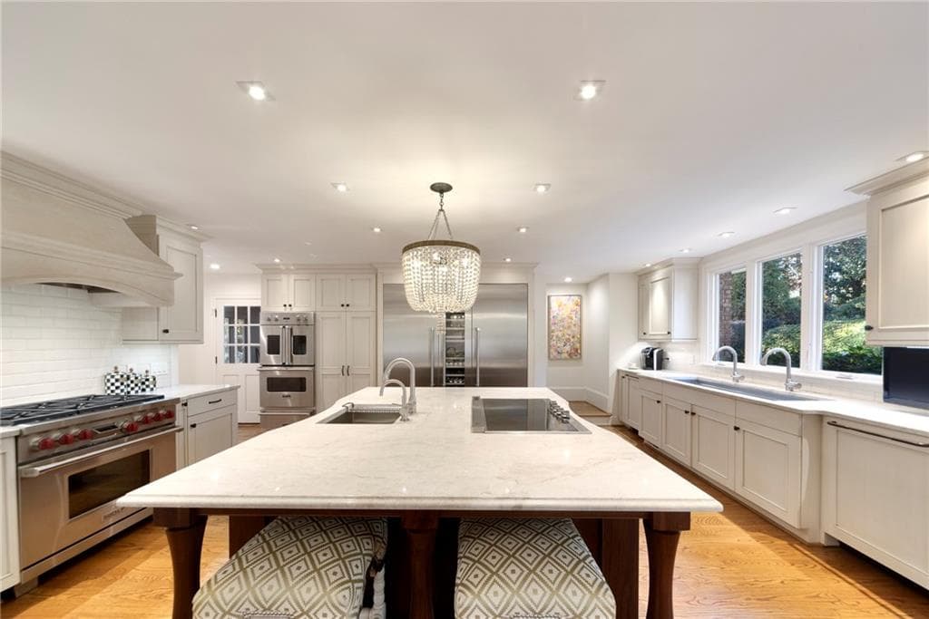 6 bedroom, 6 bathroom, 9,100 sq ft single family residence sold at 1450 Northwold Drive, Atlanta, GA 30350
