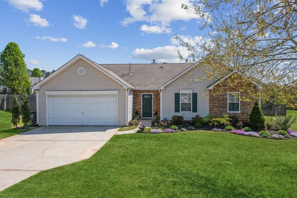 4 bedroom, 2 bathroom single family residence sold at 7535 Springmill Court, Cumming, GA 30028