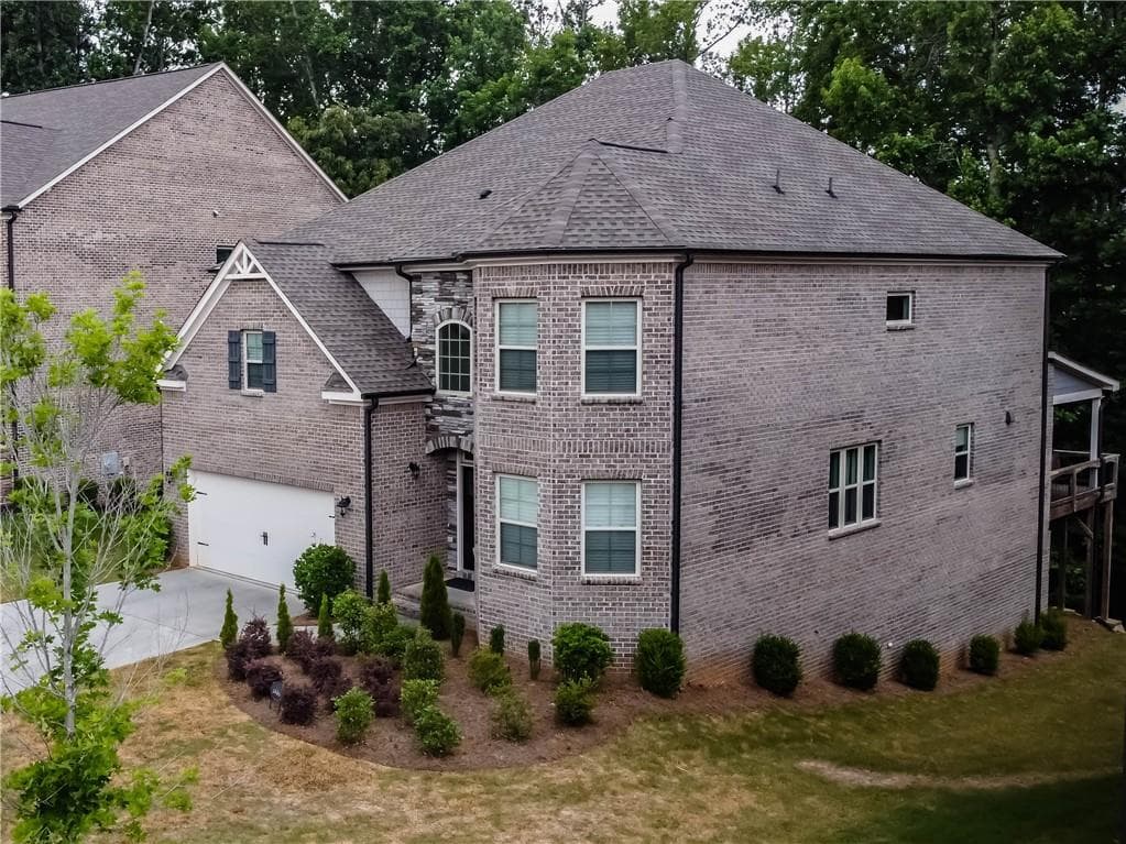 4 bedroom, 3 bathroom, 3,297 sq ft single family residence sold at 1980 Button Fern Lane, Cumming, GA 30041