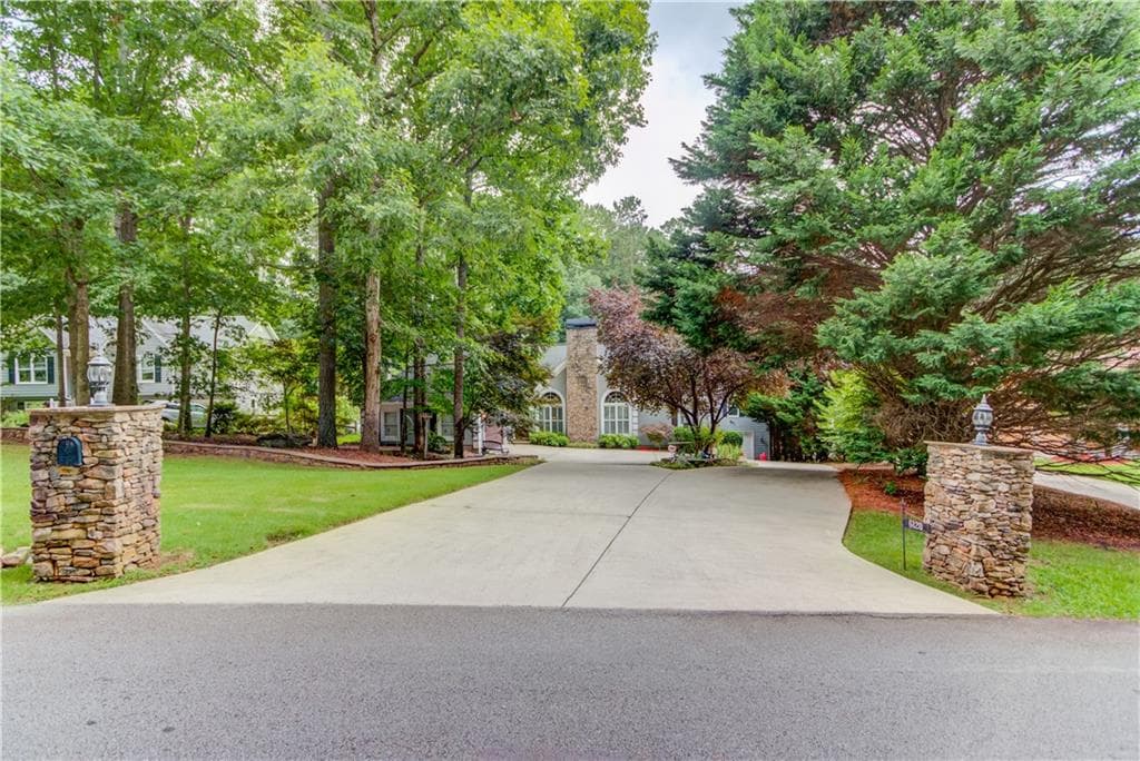 4 bedroom, 3 bathroom, 3,650 sq ft single family residence sold at 6120 Woodlake Drive, Buford, GA 30518