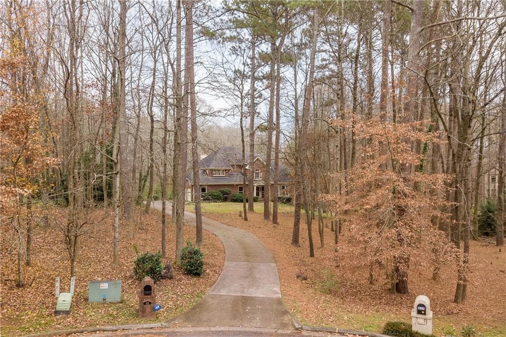 5 bedroom, 5 bathroom, 4,535 sq ft single family residence sold at 825 Brannon Oaks Lane, Cumming, GA 30041
