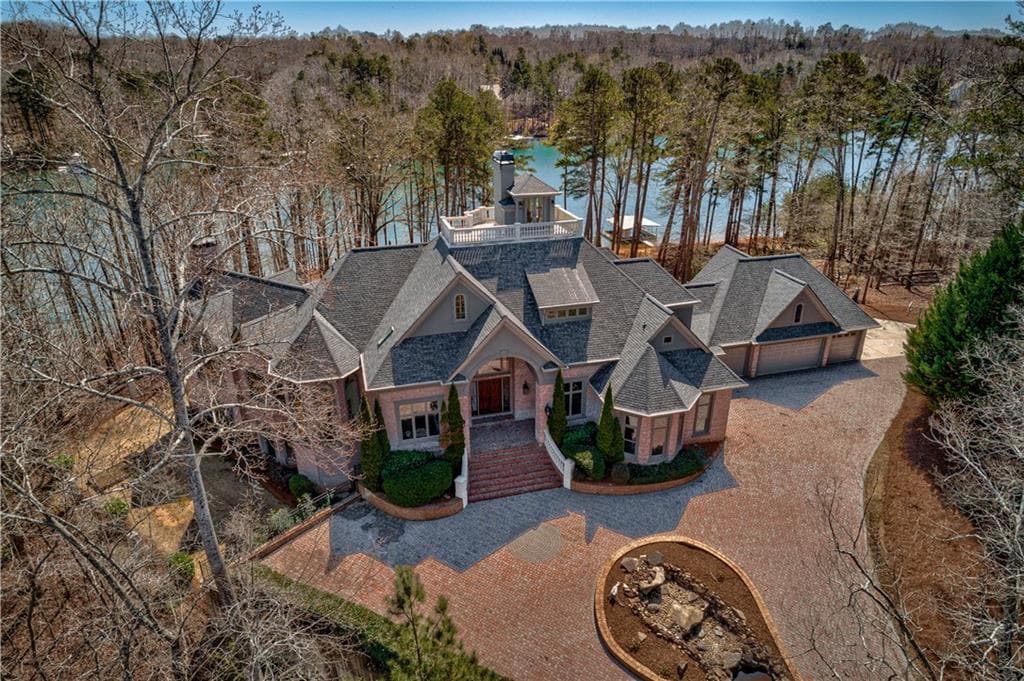 7 bedroom, 9 bathroom, 10,593 sq ft single family residence sold at 7381 Heard Road, Cumming, GA 30041