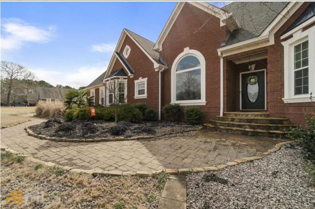 5 bedroom, 4 bathroom, 6,059 sq ft single family residence sold at 901 HANNAH Court, Loganville, GA 30052